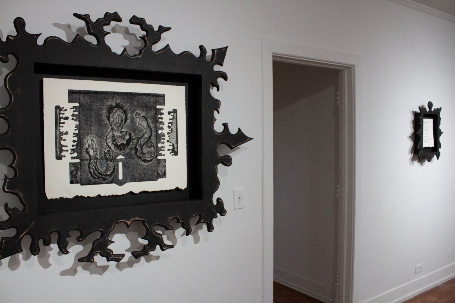 wideshot of a print and a poem on the wall