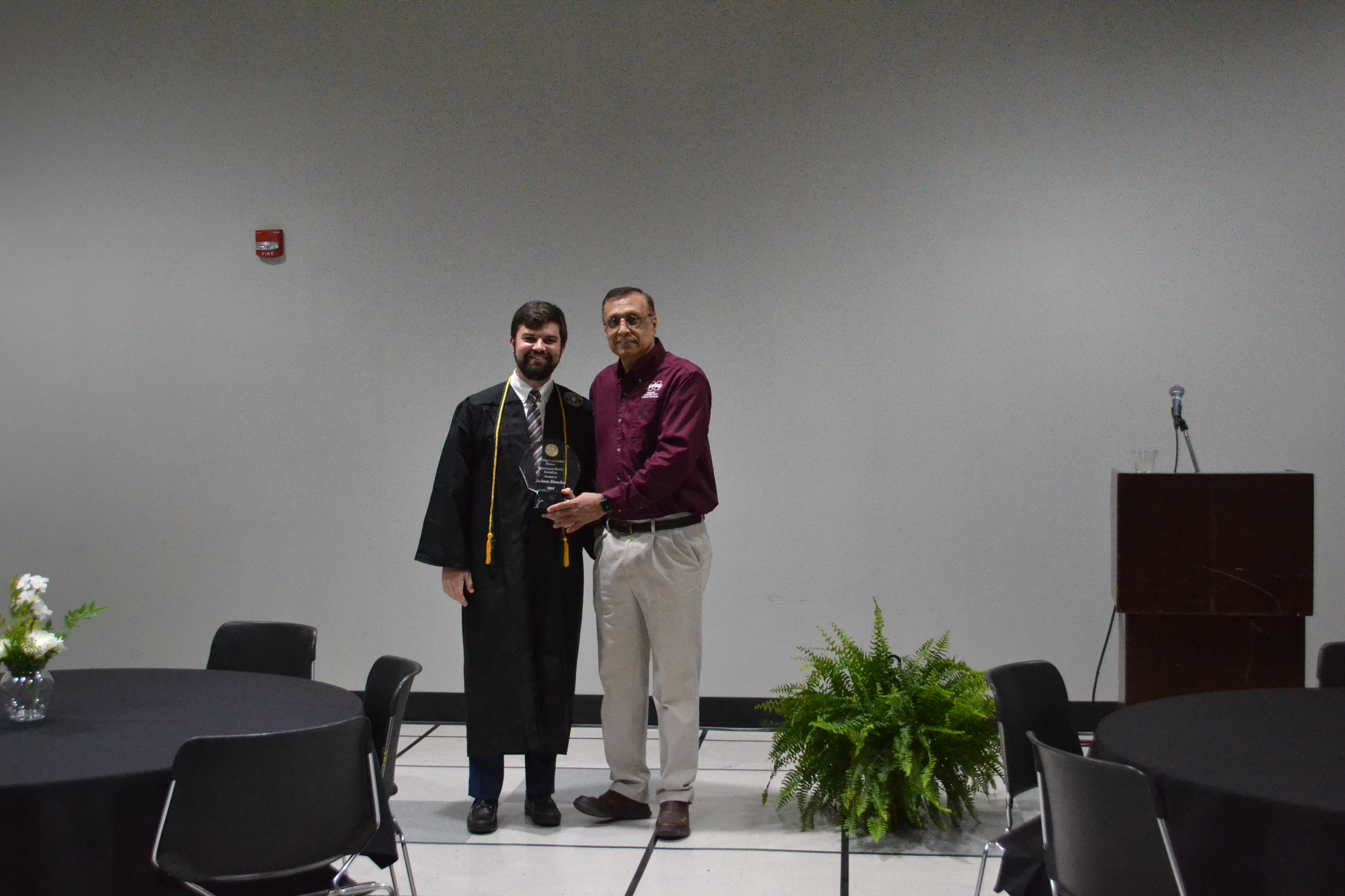 Director Syed Ahmed, right, poses with Jackson Drescher, recipient of the 2024 Director's Medallion