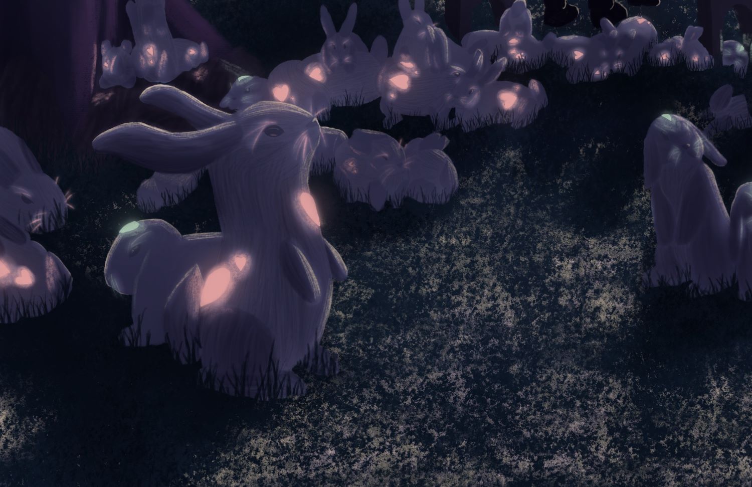 Bunnies with glowing parts on some grass.